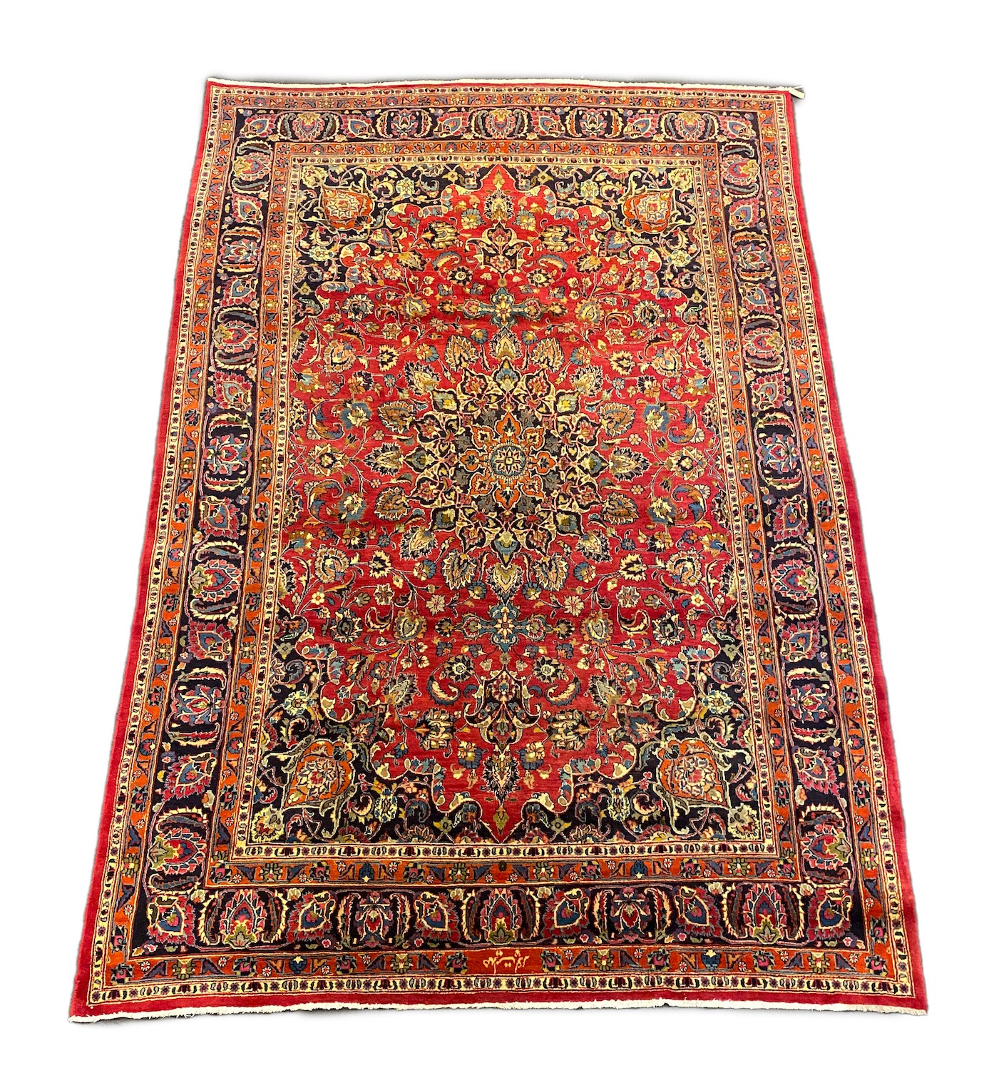 A Kashan claret ground carpet, 375cm x 250cm